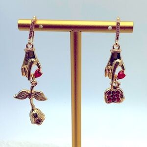 Whimsical Hand to Rose pierced earrings